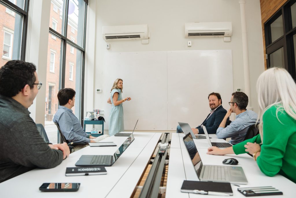 Team collaborating around a whiteboard